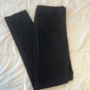 Black stretchy Kenneth Cole New York pant with zipper on the side. Size 0.